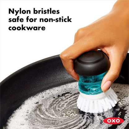 Soap Dispensing Palm Brush - US 5675